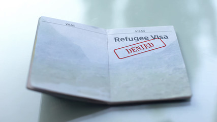 Refugee visa denied, seal stamped in passport, customs office, travelling
