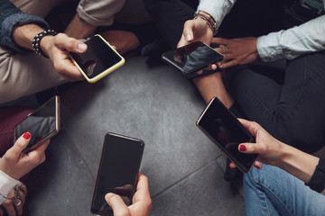 group of people addicted having fun together using smart phones