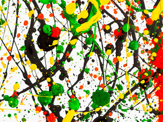 splashes on red and black and green and yellow paint