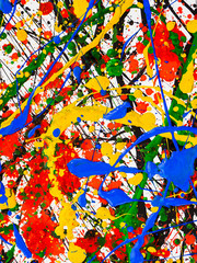 Fototapeta na wymiar splashes on red and black and green and yellow and blue paint