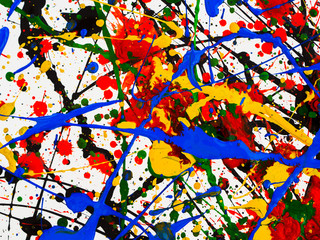splashes on red and black and green and yellow and blue paint