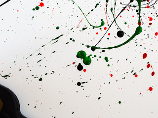 splashes on red and black and green paint