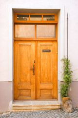 Fototapeta na wymiar Wooden door in street of Olomouc. Czech Republic