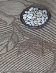Healthy food  for background image close up pistachios nuts. Texture on top view Nuts pistachio on the cup plate