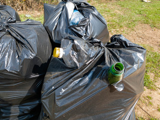 Plastic bags with garbage. Bags with garbage in nature.