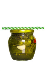 Cucumber pickle in a jar with a lid and a tube isolated on white background