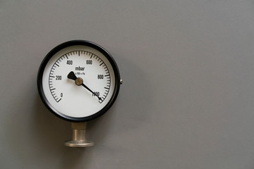 pressure gauge on gray background, engineering equipment concept
