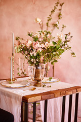Vintage wedding decor. Beautiful event venue. Creative decoration. Pink and gold color. Wedding calligraphy menu