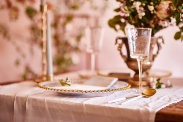 Fototapeta na wymiar Vintage wedding decor. Beautiful event venue. Creative decoration. Pink and gold color. Wedding calligraphy menu
