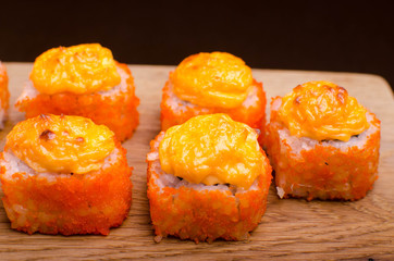 Sushi rolls with tuna and cheese. Baked Sushi Japanese cuisine in Ukrainian style. Seafood Restaurant