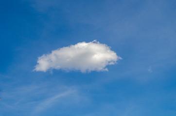 beautiful lonely white cloud on blue sky. Background.