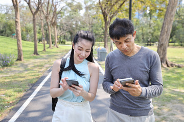 man and woman is digital addictive social era by using internet from cell phone all the time