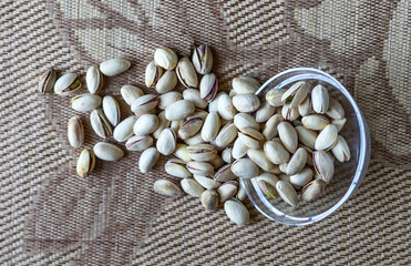 Healthy food  for background image close up pistachios nuts. Texture on top view Nuts pistachio on the cup plate