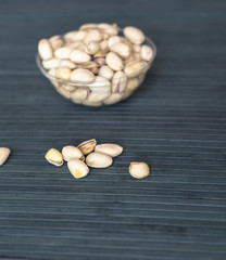 Healthy food  for background image close up pistachios nuts. Texture on top view Nuts pistachio on the cup plate