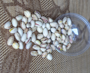 Healthy food  for background image close up pistachios nuts. Texture on top view Nuts pistachio on the cup plate