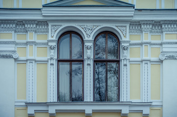 Window of beautiful neoclassical house. Verkiai Palace complex in Verkiai Regional Park. Lithuania. Baltic. Close-up.