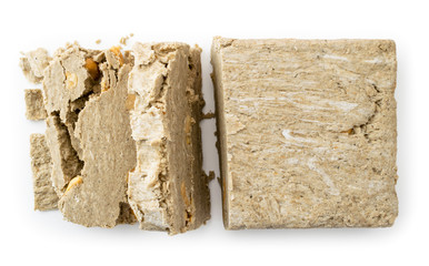 Halva cut into pieces on a white. The form of the top.