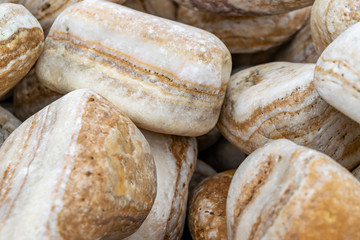 Natural beige and sand colors in the structure of stones background. Beautiful pattern of the structure of stones in natural colors. 