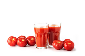 Tomato juice in a glass, with tomatoes on a white background