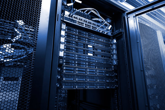 Blade server in rack cluster hard drives storage in internet data center room black and white tone