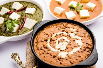Palak paneer butter masala, yellow dal or dal-makhani served in a bowl in a group. selective focus
