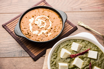 Palak paneer butter masala, yellow dal or dal-makhani served in a bowl in a group. selective focus