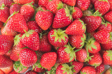 Fresh red strawberry fruit background.