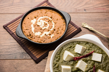 Palak paneer butter masala, yellow dal or dal-makhani served in a bowl in a group. selective focus