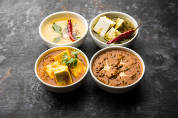 Palak paneer butter masala, yellow dal or dal-makhani served in a bowl in a group. selective focus