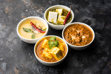 Palak paneer butter masala, yellow dal or dal-makhani served in a bowl in a group. selective focus