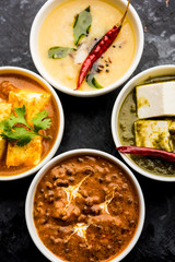 Palak paneer butter masala, yellow dal or dal-makhani served in a bowl in a group. selective focus