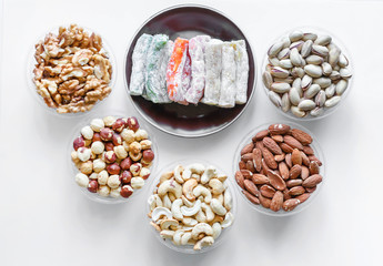 Traditional Turkish Delight. Oriental dessert on a  plate. Isolated on white background. Eastern delicacy sweets. Healthy food mix assortment. Collection of different for image close up top view