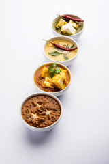 Palak paneer butter masala, yellow dal or dal-makhani served in a bowl in a group. selective focus