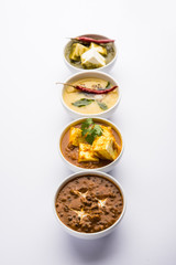 Palak paneer butter masala, yellow dal or dal-makhani served in a bowl in a group. selective focus