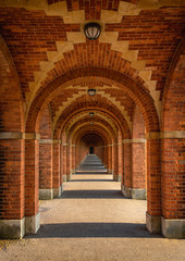 Perspective of a long brick archway