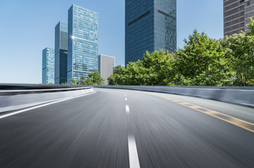 Obraz premium Empty road floor surface with modern city landmark buildings of hangzhou bund Skyline,zhejiang,china