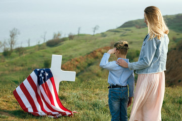 Mom and son visited the grave of the father on the memorial day 27 may