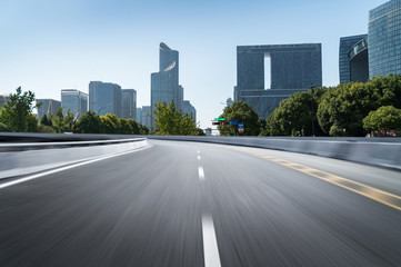 Obraz premium Empty road floor surface with modern city landmark buildings of hangzhou bund Skyline,zhejiang,china