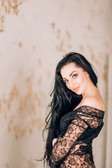 Sexy woman wearing black lace robe in bathroom