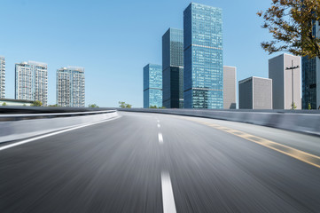 Fototapeta premium Empty road floor surface with modern city landmark buildings of hangzhou bund Skyline,zhejiang,china