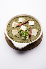 Palak Paneer Curry made up of spinach and cottage cheese served in a bowl. selective focus