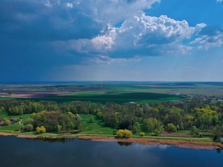landscape with lake and clouds in Minsk Region of Belarus