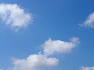 Naklejka na ściany i meble The vast blue sky with soft white clouds. Abstract white and blue background.