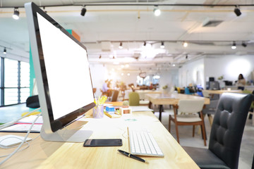 modern office with computer on wood desk, office supplies and coffee cup