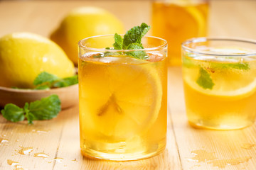 iced tea with lemon slices and fresh mint leaves