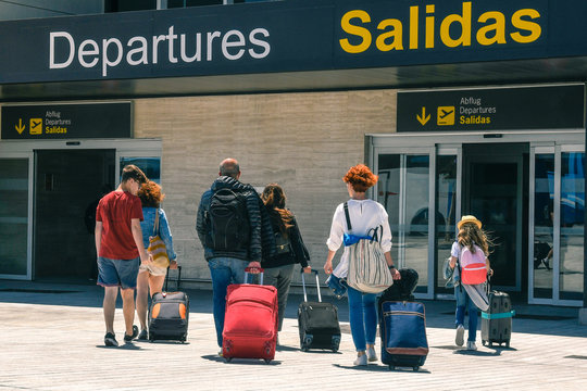 Family On A Plane. Friends Returning From Vacation Walk Sad At Airport Departures. Adults And Children Leaves Happy For Carefree Days Of Break. Group Of People Traveling With Luggages After Holidays