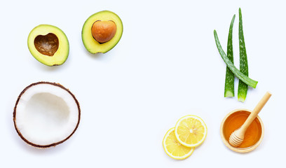 Natural ingredients for homemade skin care on white background.