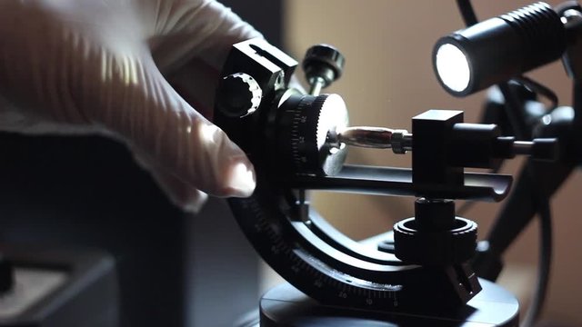 Criminal Police Laboratory, close-up microscopic examination of  bullet, firearms identification, crime investigation, ballistic expertise.
