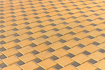 fragment of the sidewalk of yellow bricks