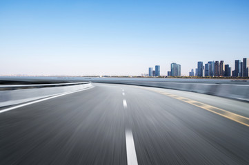 Fototapeta premium Empty road floor surface with modern city landmark buildings of hangzhou bund Skyline,zhejiang,china